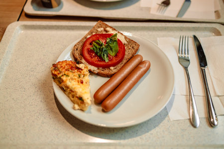 Breakfast homemade lunch plate with fried egg and sauce, tomato. High quality photoの写真素材