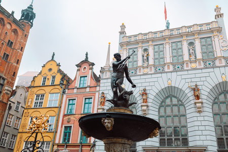 Gdansk, Poland - October 31, 2022: Beautiful fountain in the old center of Gdansk city, Poland. High...