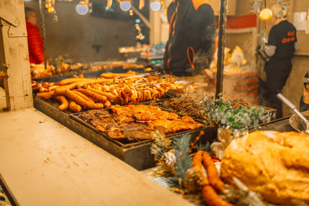 Selling traditional polish bread and hot fast street food at the Christmas Fair on the Main Market Square in historical center of Krakow. High quality photoの写真素材