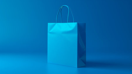 Close up cropped blue paper bag with food products or gift present isolated on blue color wall background studio. Delivery service from shop or restaurant concept. Copy space advertising mock upの素材