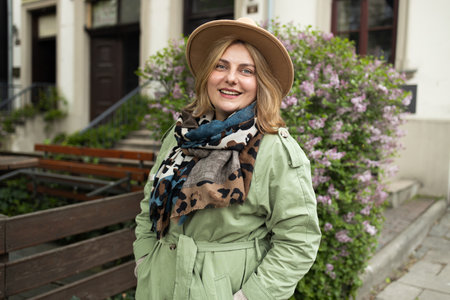 Beautiful young relaxed woman enjoying nature fresh air at city street on an autumn. High quality photoの写真素材