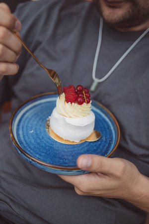 Close up of delicious tart - dessert with meringue swirl on the top, coffee break with confectionery in a cafe. High quality FullHD footageの写真素材