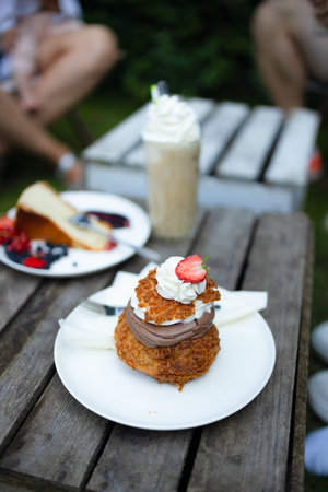 Summer dessert with fresh raspberry and mascarpone cheese and biscuit on a wooden board. Healthy food, vegan, sugar, gluten and lactose free. Berry dessert, cheesecakeの写真素材