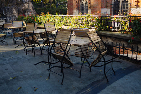 Outdoor cafe interior. simple, tasteful tables with chairs. High qualityの写真素材