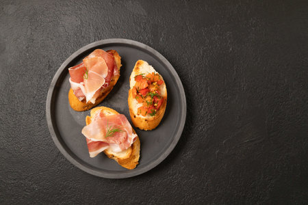 Tasty bruschetta served with wine on gray background. High quality photoの写真素材