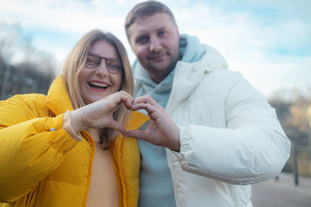 Close up photo amazing beautiful she her he him his guy lady hands arms fingers make heart figure...
