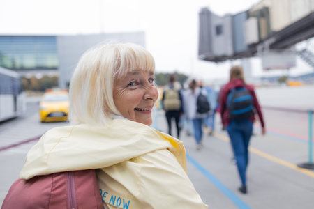Travel, airport and excited woman with passport is going to board the plane. travel ticket and documents for immigration, journey and flight schedule. Backpack person with identity documentの写真素材