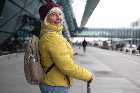 International airport terminal. Woman with luggage and walking in airport. High quality photoの写真素材
