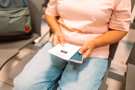 Qr code, check in and man with a phone for a ticket, airplane booking and information at airport. Travel, website and hand of a businessman reading a barcode on a mobile for a work trip or vacation. High quality photoの写真素材