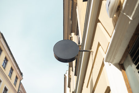 Blank Round Signboard on Historic European Buildingの写真素材