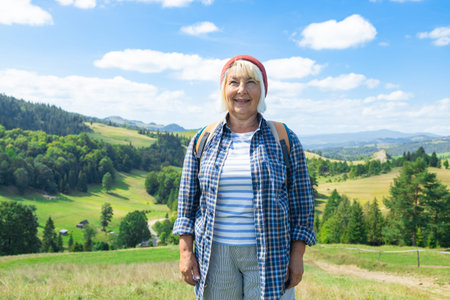 Elderly woman standing on a lush green hillside with a backpack, looking content and inspired by the...