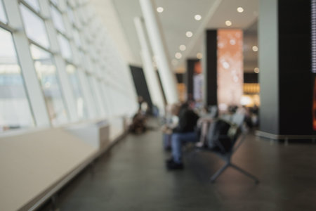 Defocused Background of Modern Airport Terminal Interior with Unique Architectural Design and Bright...