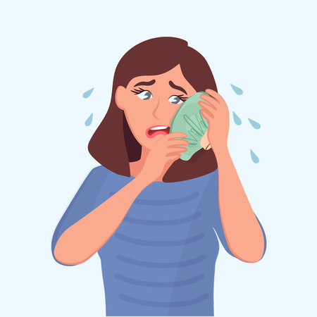 The sad girl holds a bag of ice at the sick tooth. Toothache. Vector illustration of a cartoon sick peopleのイラスト素材