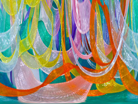 A background from multi-coloured tapes from kapronの写真素材