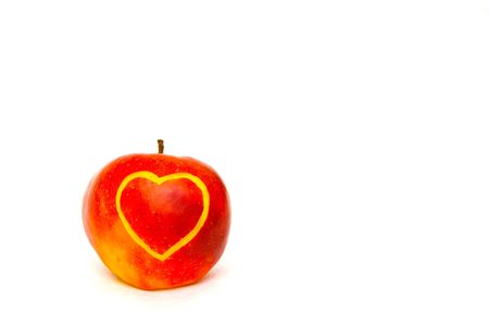 The image of the apple on which heart is cut outの写真素材