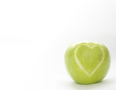 The image of the apple on which heart is cut outの写真素材