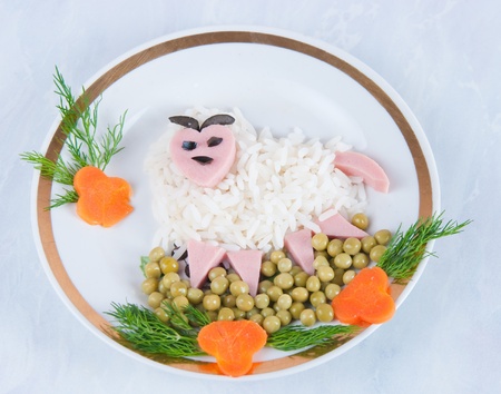 Dish from boiled rice, sausage and tinned peasの写真素材