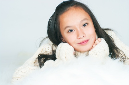 The beautiful Asian girl in a knitted sweaterの写真素材