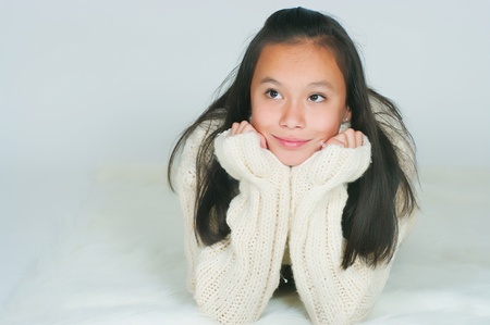 The beautiful Asian girl in a knitted sweaterの写真素材