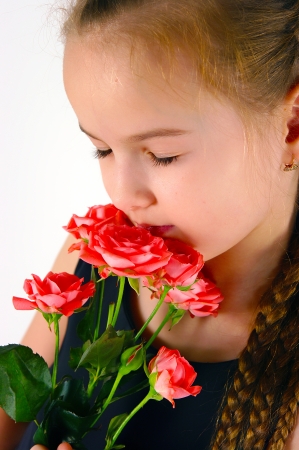 the girl with a rose on a white backgroundの写真素材