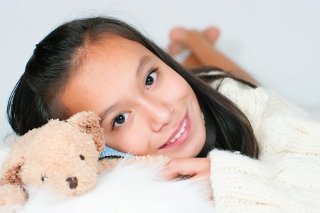 The beautiful Asian girl in a knitted sweaterの写真素材