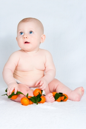 the amusing kid in a hat  on a light backgroundの写真素材