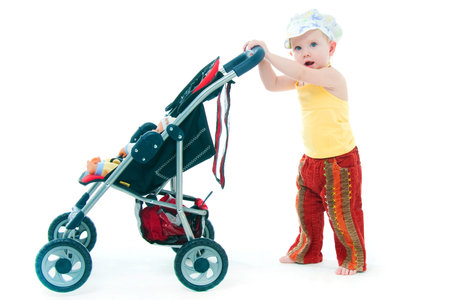 the little girl with a toy carriage on a white background