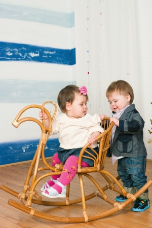 The image of the little girl on a horse rocking chairの写真素材