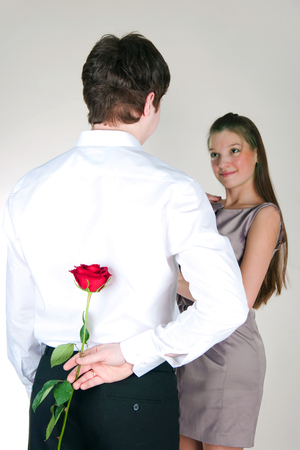 Portrait of the guy and girl with a roseの写真素材