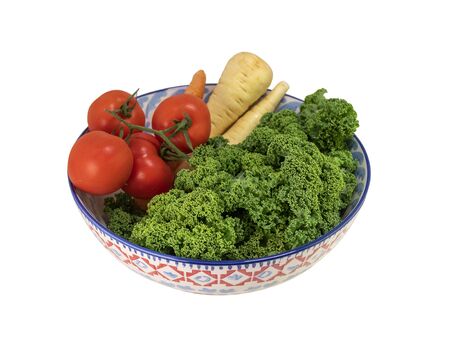 Fresh vegetables  in a bowl isolated on white backgroundの写真素材