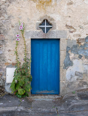 Blue door in an old stone house. Franceの写真素材