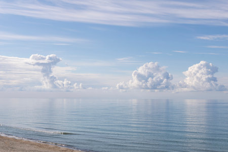 Blue sky with clouds over the seaの写真素材