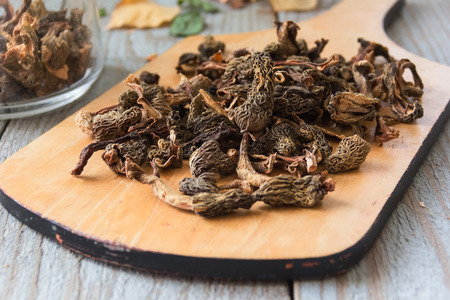 Dried mushrooms on a cutting Boardの写真素材