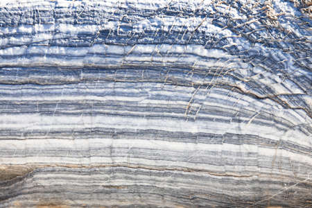 The background is a natural plate made of gray violet carar marble / Macro.の写真素材