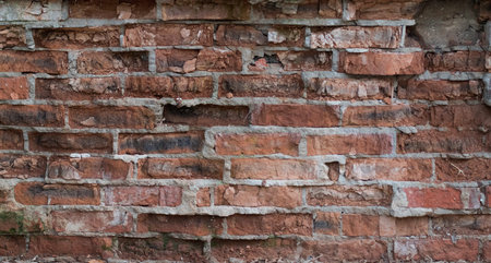 Old weathered rough textured brickwork. broken brickwork with gray mortar