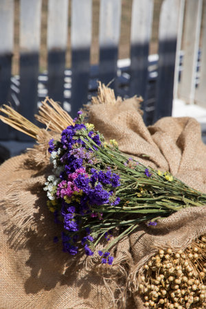 bouquet of wildflowers and herbs on burlap on the day of the summer solsticeの写真素材