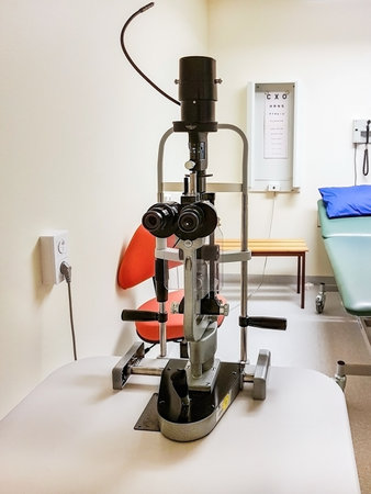 medical ophthalmology equipment for eye examination. Medical eye examination slit lamp. Optometristic equipment in ophthalmology clinic. Ophthalmology clinic equipment Slit lamp examination.の写真素材