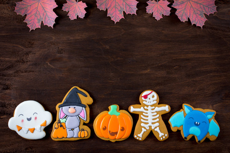 Funny gingerbread cookies for Halloween on a dark background. Top view.の写真素材
