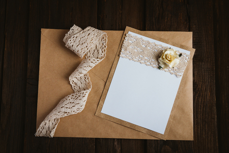 The basis for the writing on the brown wooden table in retro style hand made paper roseの写真素材