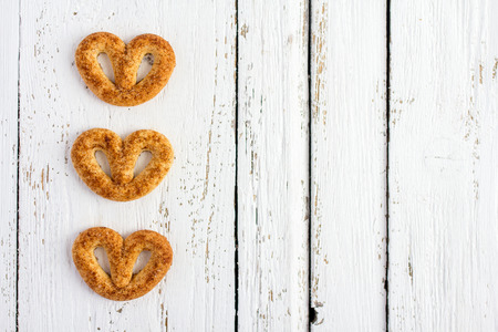 Pretzel with cinnamon and sugar on white tableの写真素材