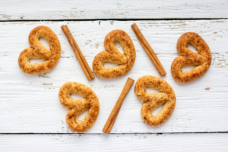 Pretzel with cinnamon and sugar on white tableの写真素材