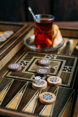 Turkish sweets and tea on the backgammon Board