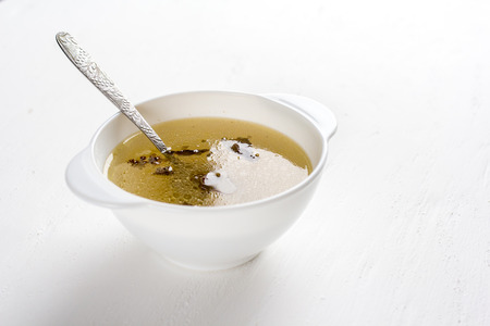 Chicken soup in a white plate. Diet. Selective focus.の写真素材