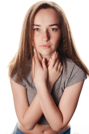 Simple portrait of young beautiful girl brunette in the Studio. Teenage style. Toning.の写真素材