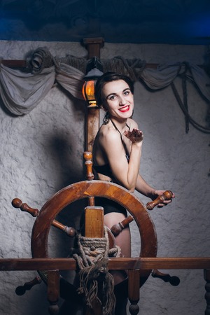 Young beautiful woman in salt room in a bathing suit. The marine theme. Toning.の写真素材