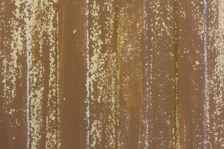 Texture of old sheet metal with worn brown paint