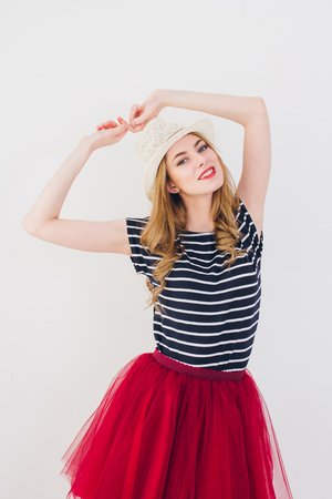Young beautiful blonde girl posing in Studio on a white background. Toning.の写真素材