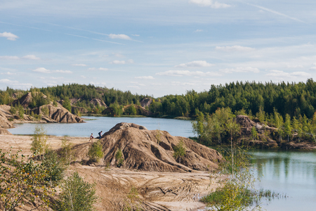 Abandoned sand quarry to the blue lake. Konduki, Tula region, Russia. Toningの写真素材