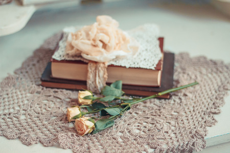 Delicate composition with old books decorated in rustic style. Selective focus. Vintage toning.の写真素材