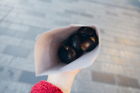 Fresh roasted chestnuts in hand. National dish of Turkey, Istanbul.の写真素材
